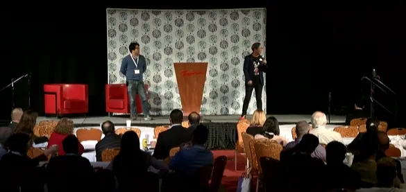 Leo Szeto and Jonathan Chew delivering their double-keynote on stage at the IEEE Rising Stars conference